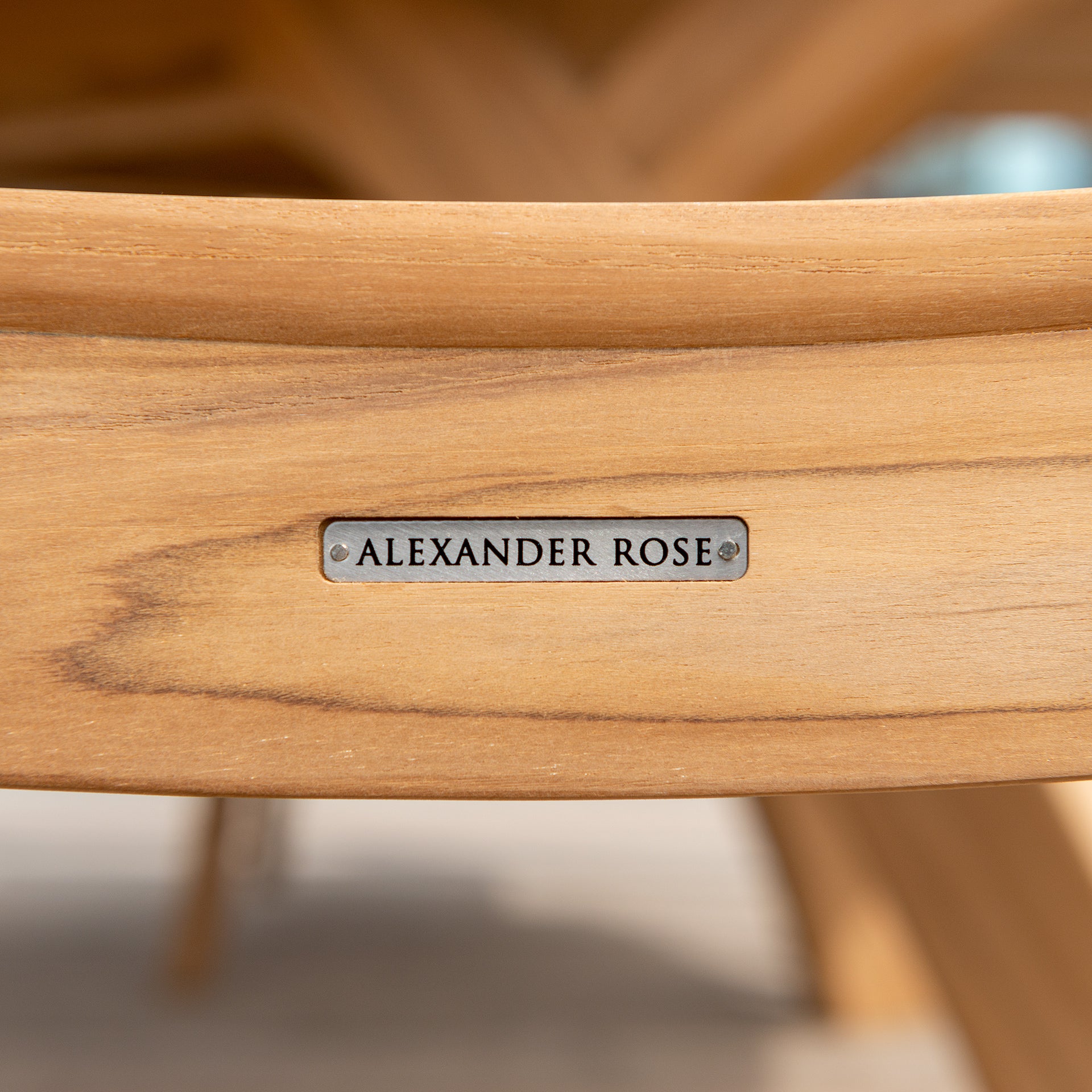 Alexander Rose metal label recessed on the back of a wood dining chair