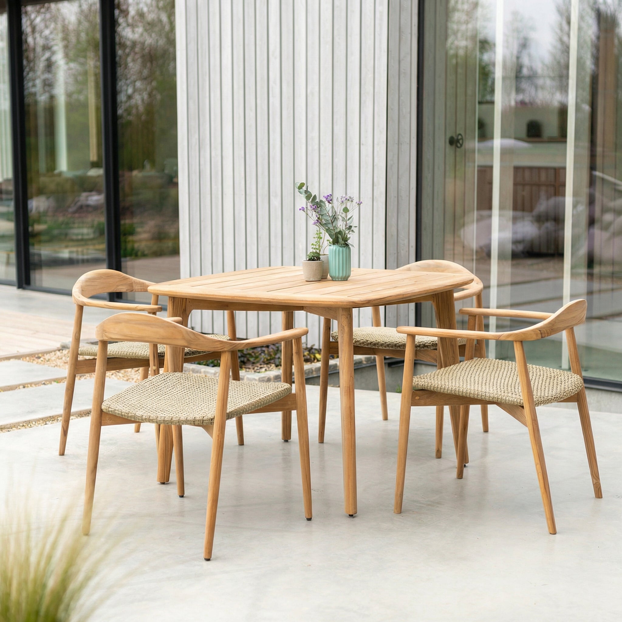 Wooden dining table with chairs on a patio