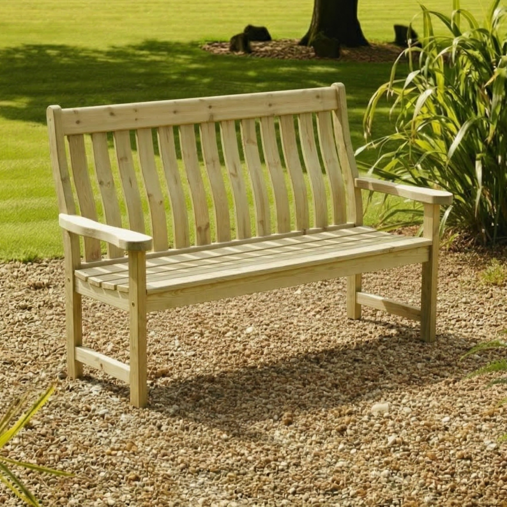 Wooden garden bench on a gravel path with grass and plants in the background