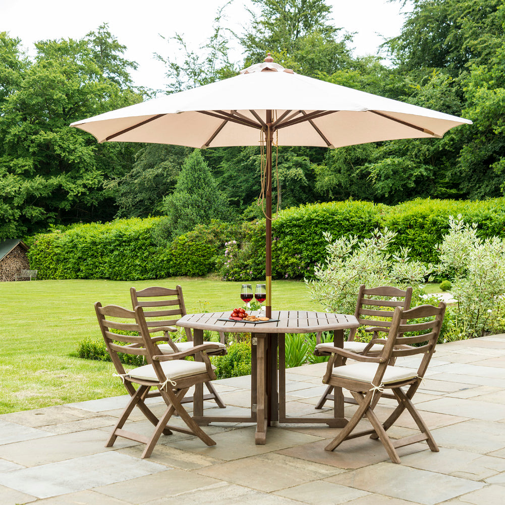Sherwood Gaitleg Outdoor Table with 4 folding chairs and cream parasol by Alexander Rose