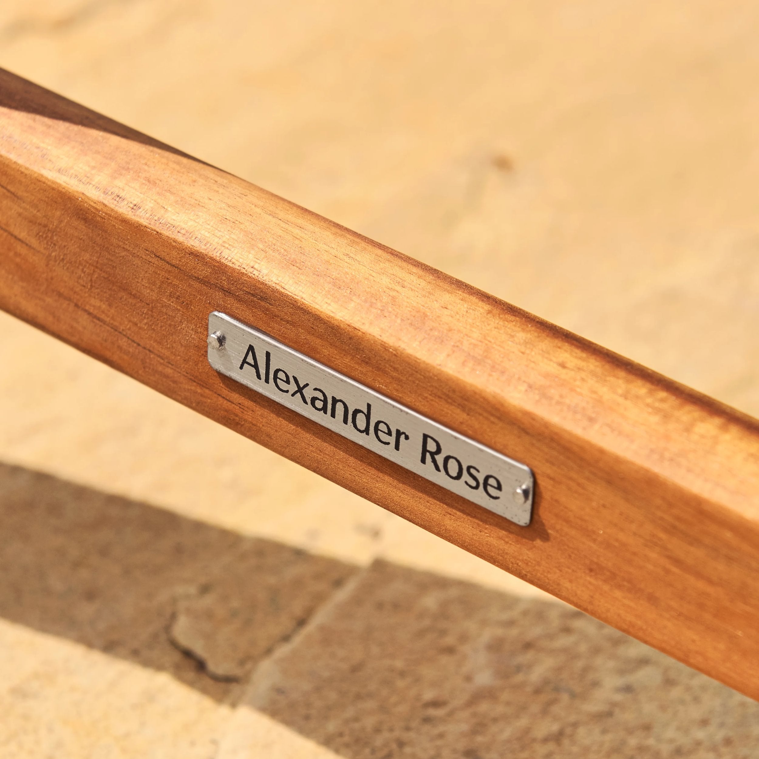 Wooden product with a 'Alexander Rose' label on a blurred background