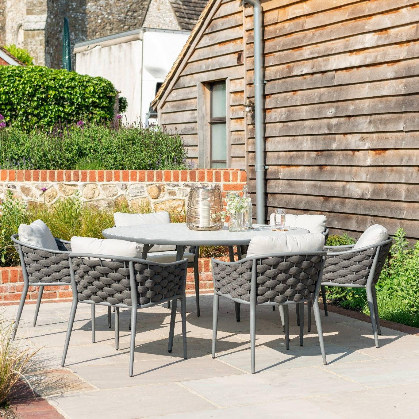 Torino Large Round Dining Table Presented with a Set of 6 Dining Chair