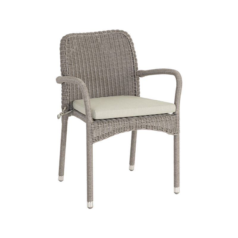 Wicker chair with a cushion on a white background