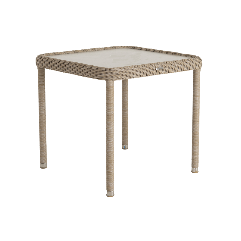 Square outdoor table with wicker frame and glass top on a white background