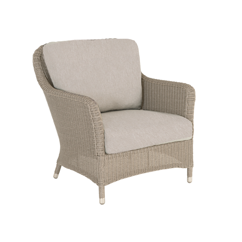 Wicker armchair with beige cushion on a white background