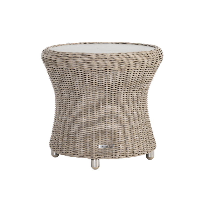 Wicker side table with a white top on a white background