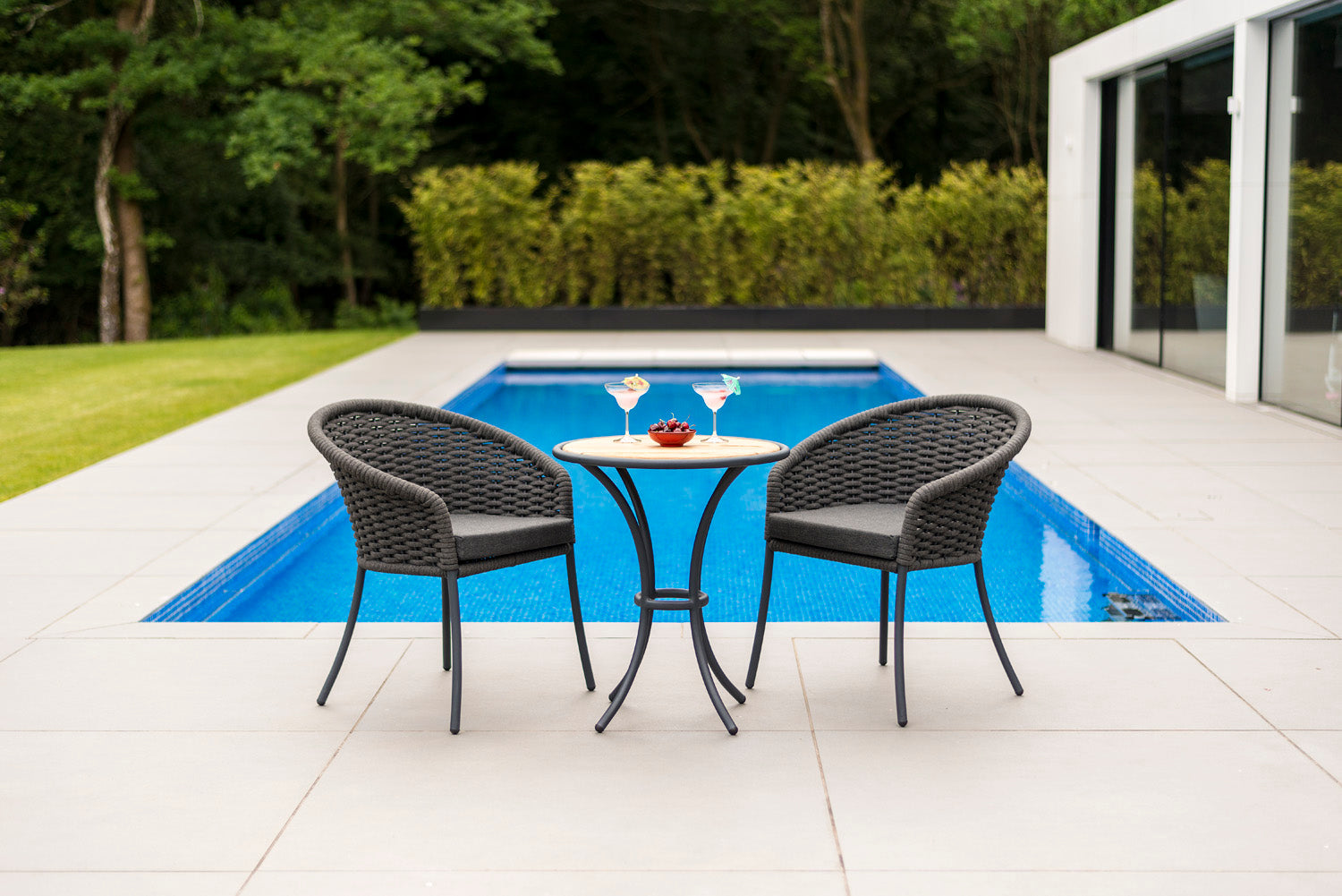 outdoor chairs by poolside