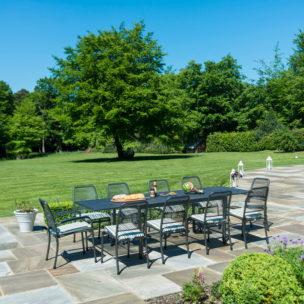 Portofino extending rectangular dining table with 8-side chairs and 2-armchairs