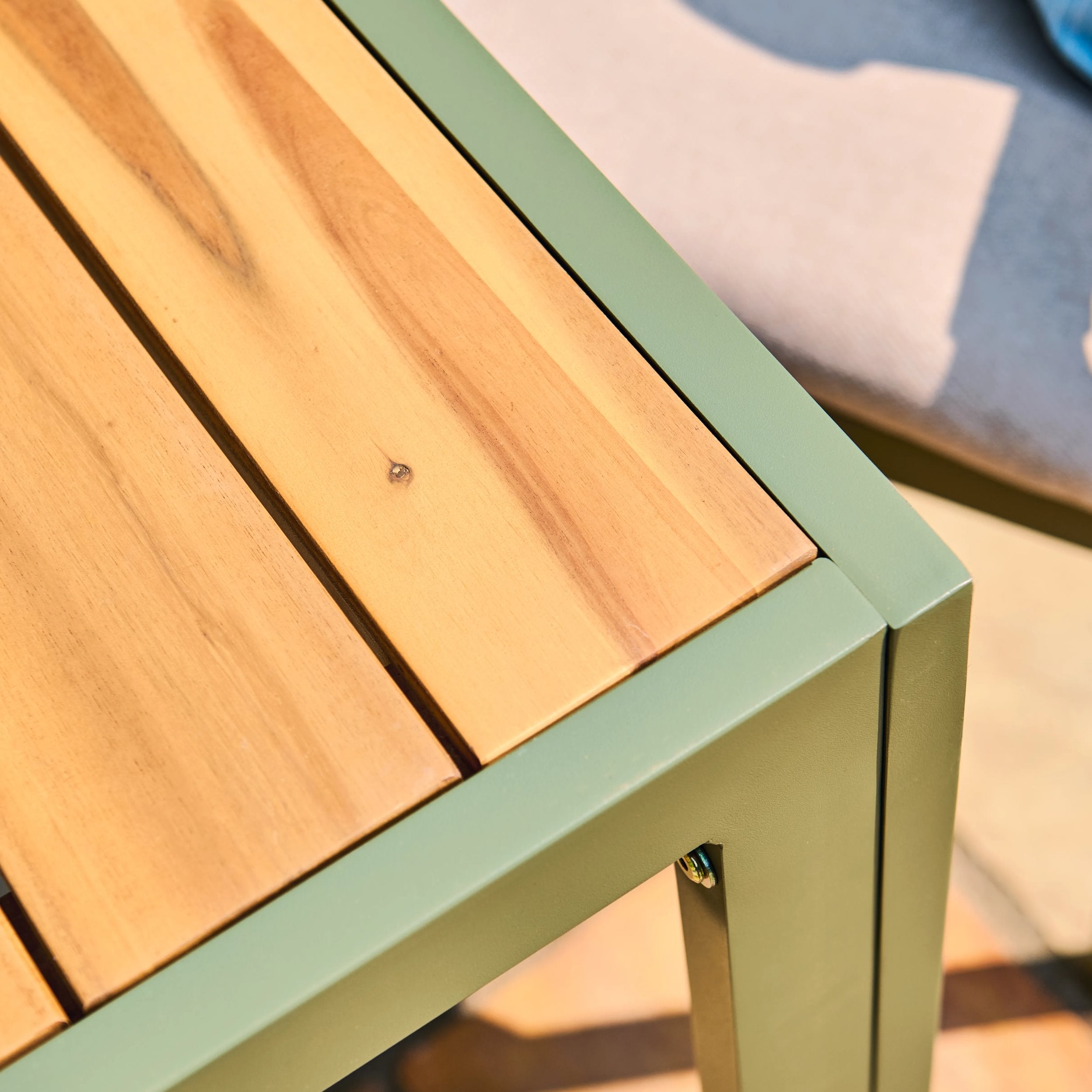 Timber surface with a green metal frame