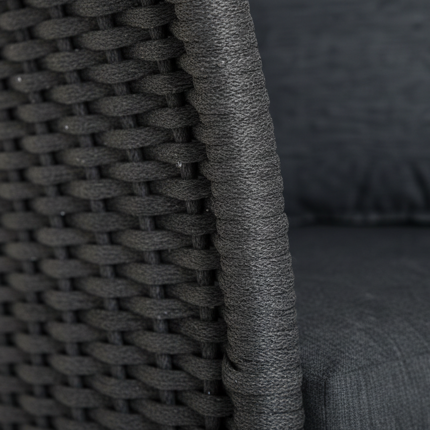 Woven chair detail on a cordial chair in dark grey