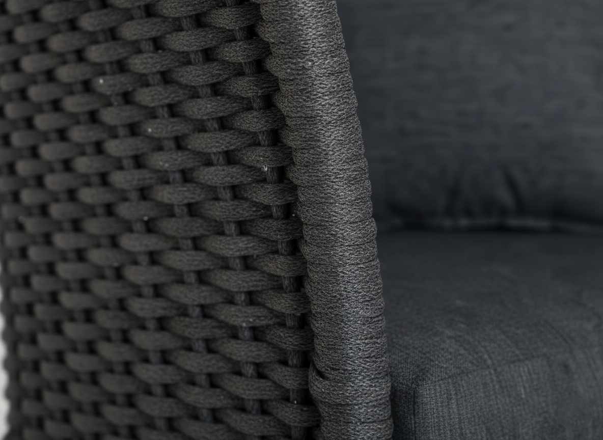 Woven chair detail on a cordial chair in dark grey