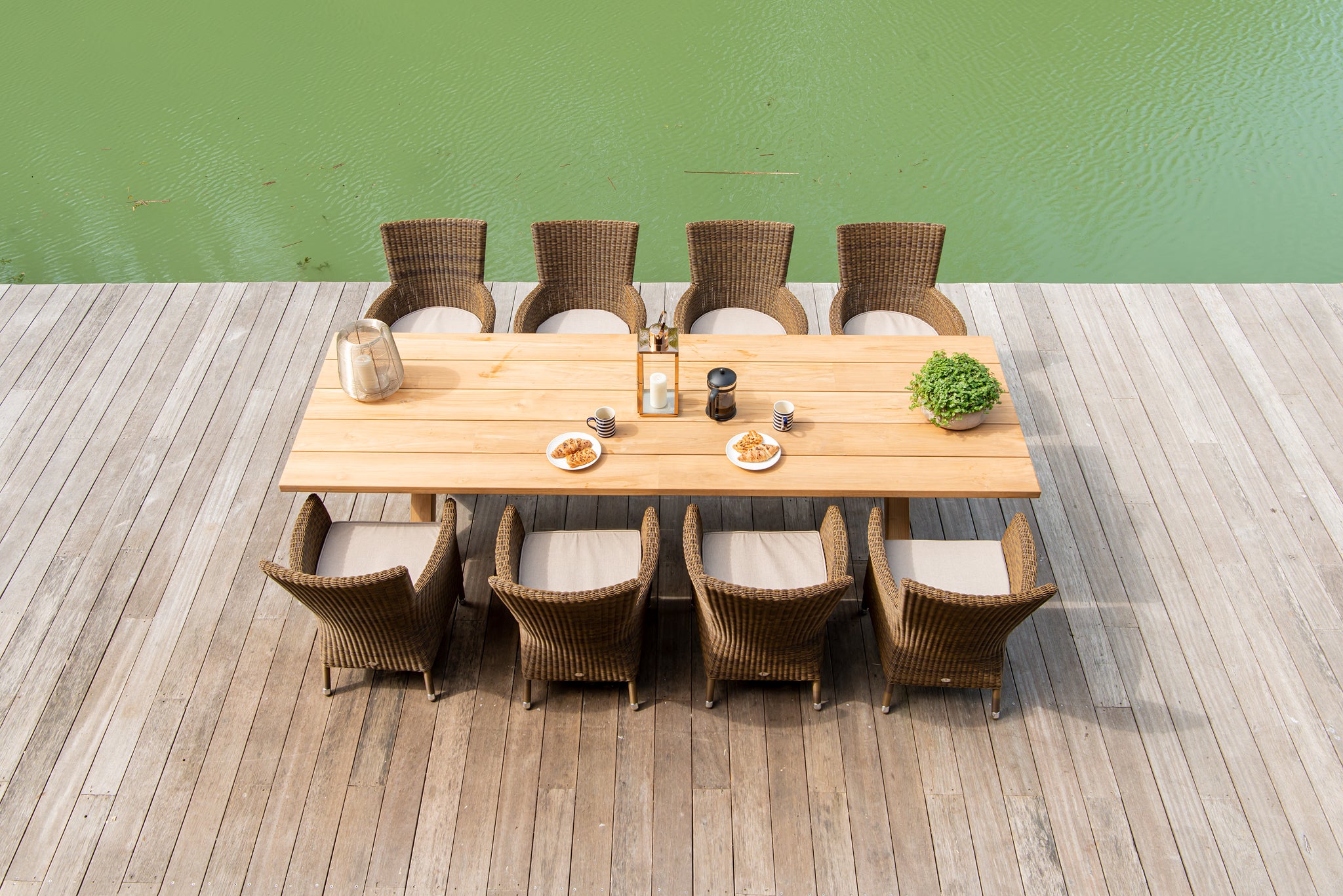 Teak rectangular dining table with luxury rattan armchair's top view