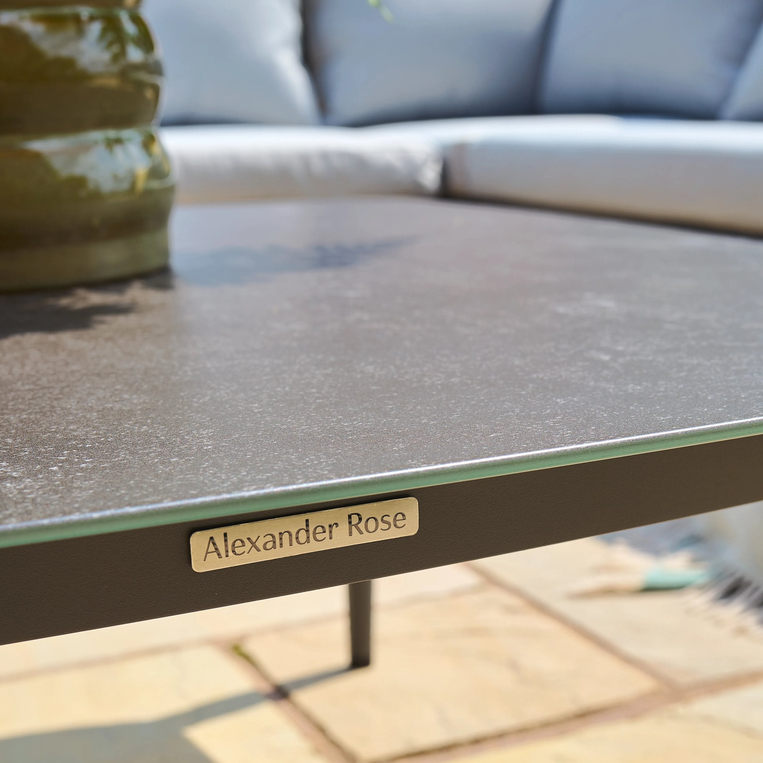 Table with 'Alexander Rose' branding in an outdoor setting