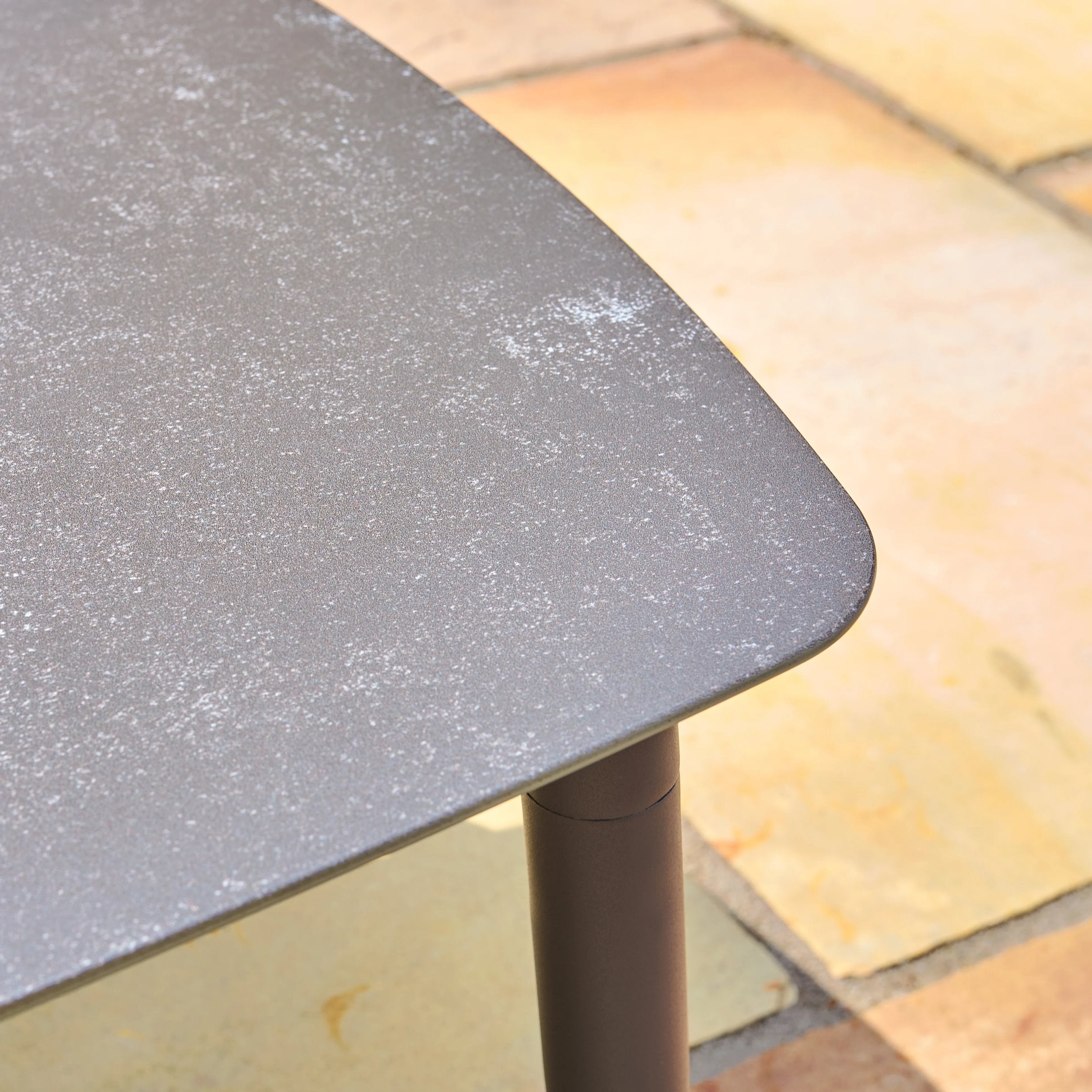 Gray table top on a tiled floor
