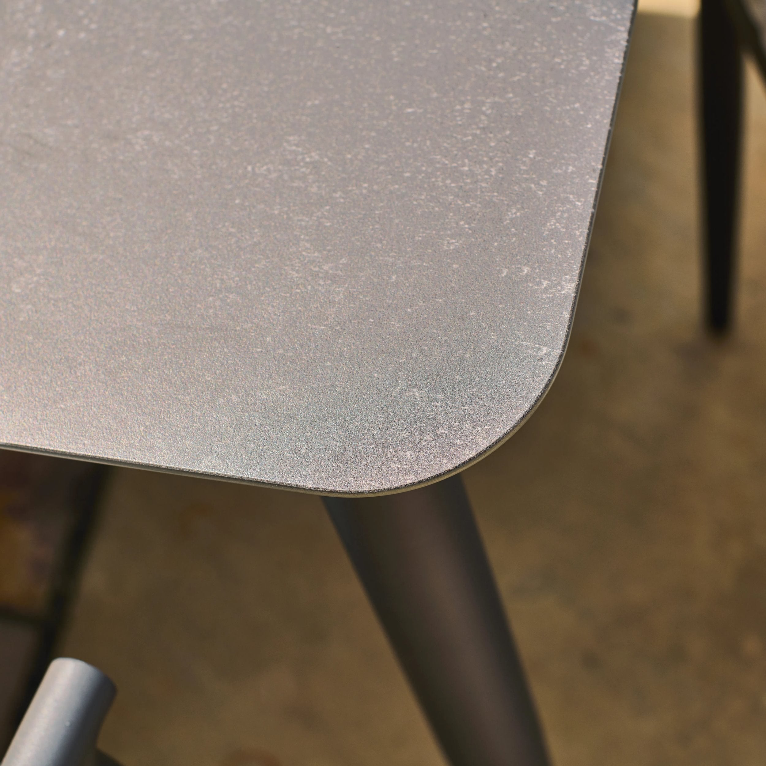 Close-up of a metallic surface with a blurred background