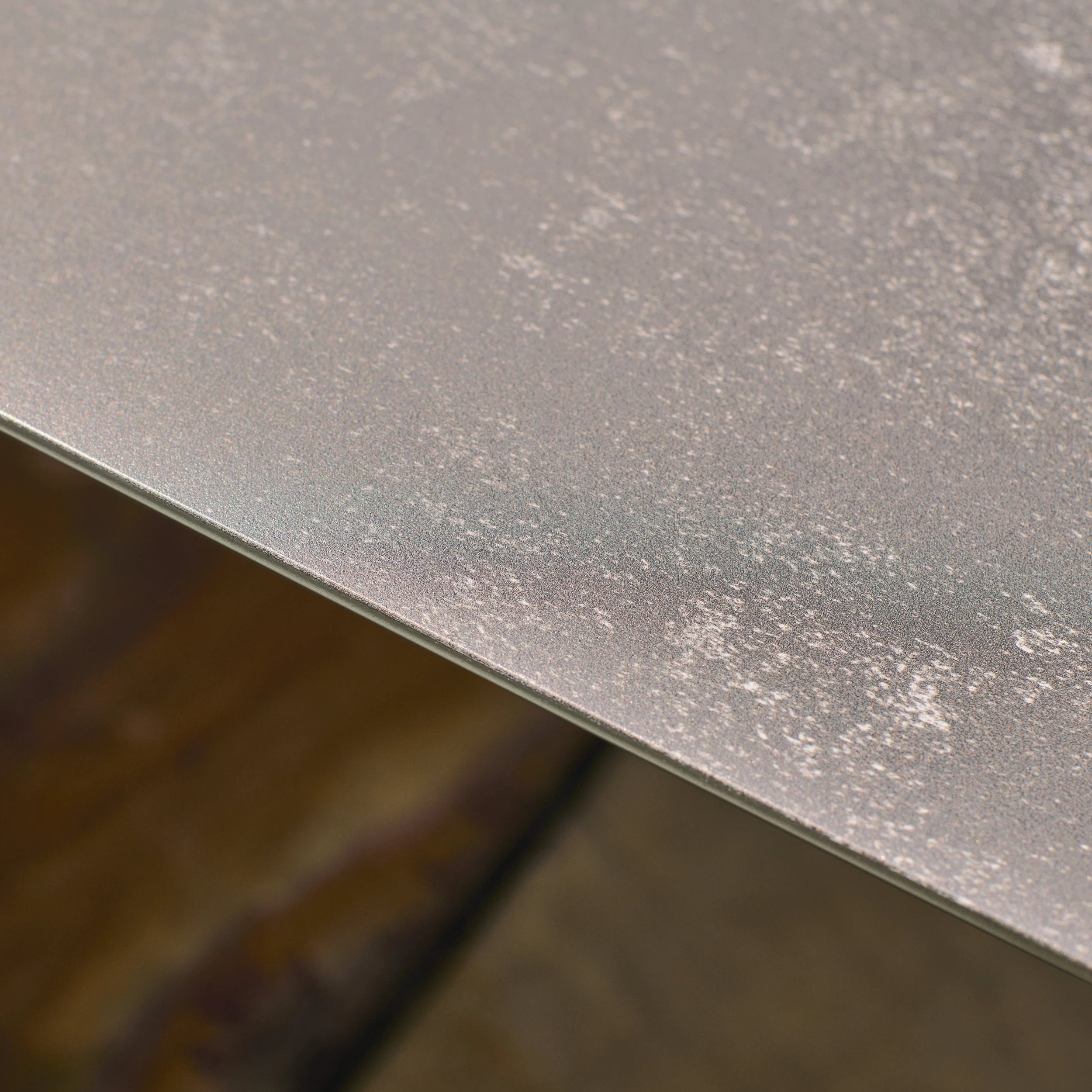Close-up of a textured grey surface with a blurred background