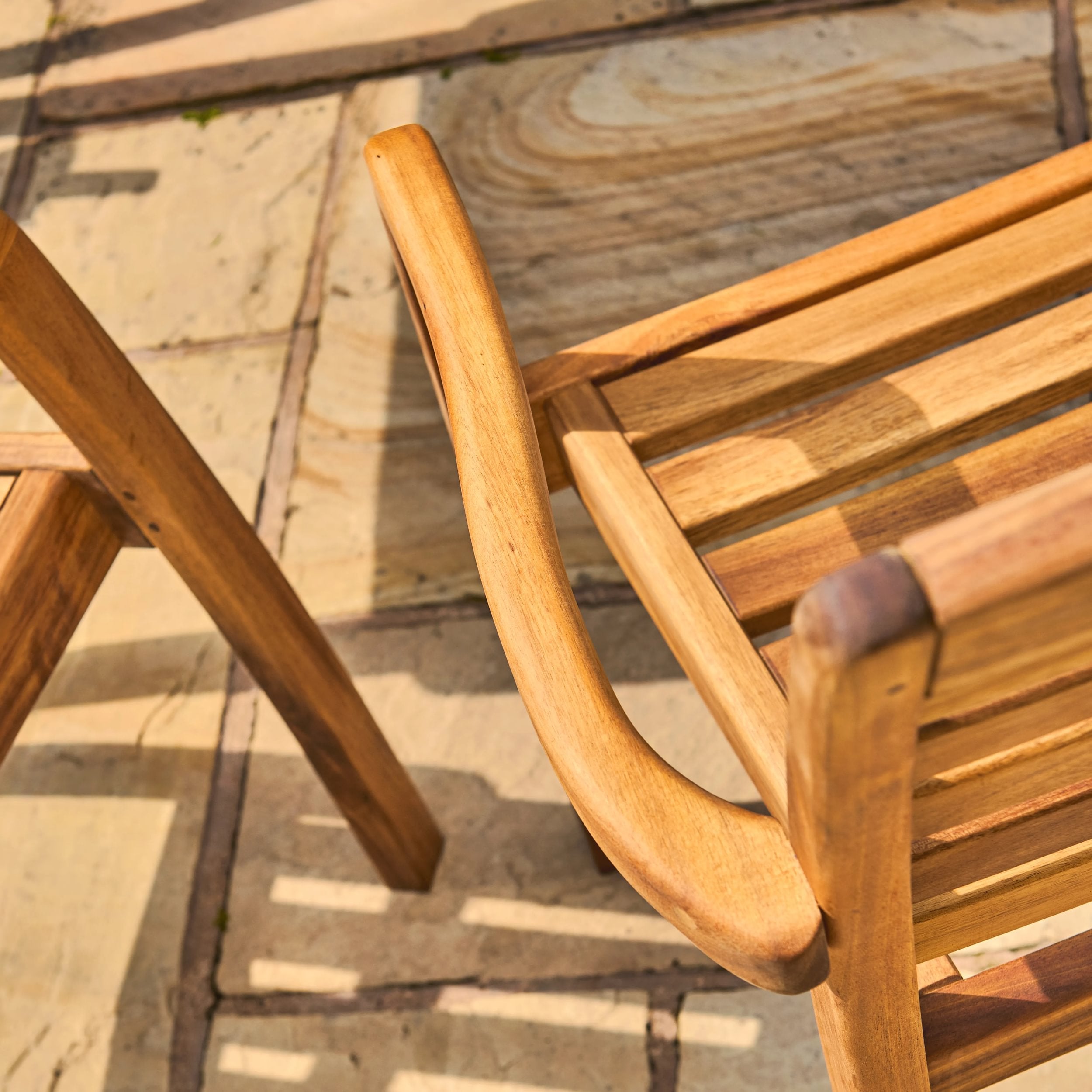 Wooden chair on a stone patio