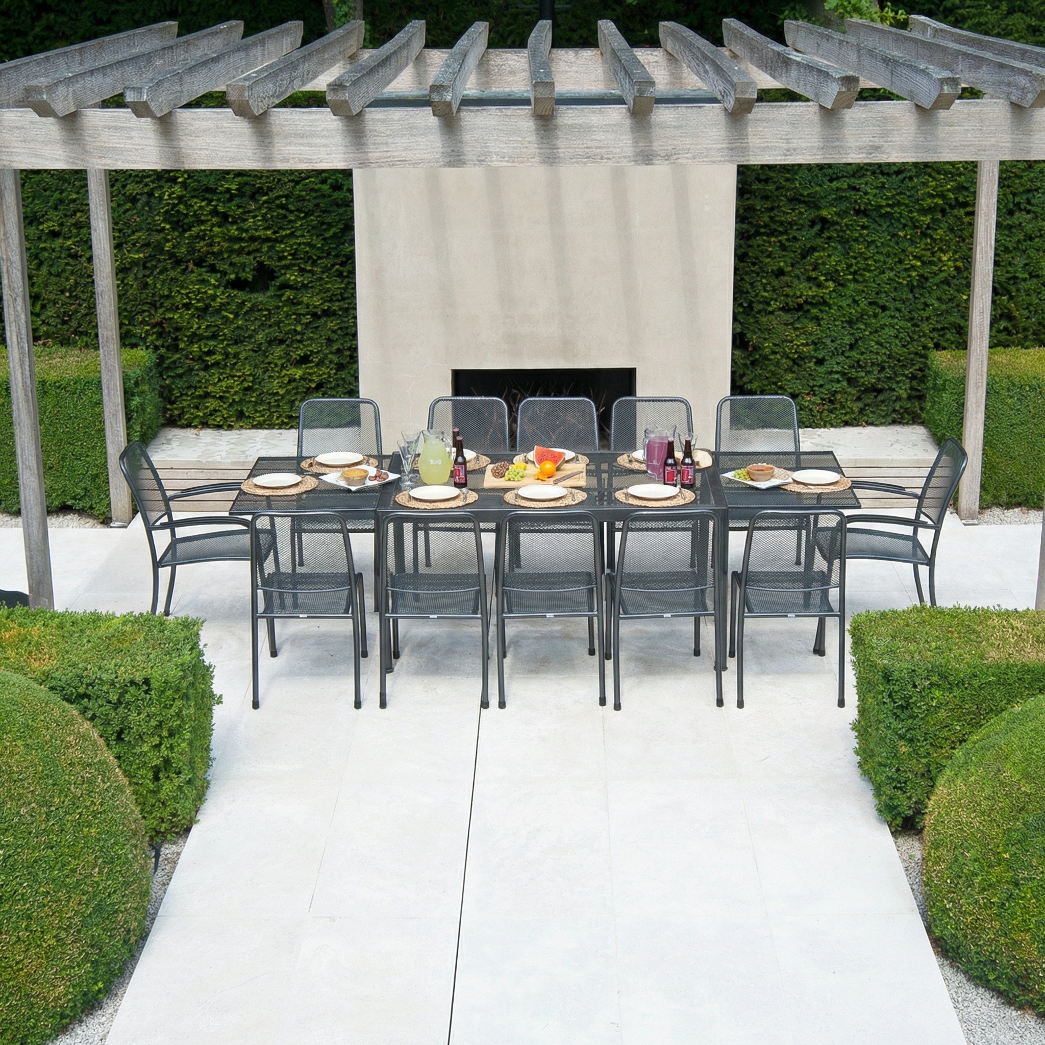 Portofino extending dining table presented with side chairs and armchairs