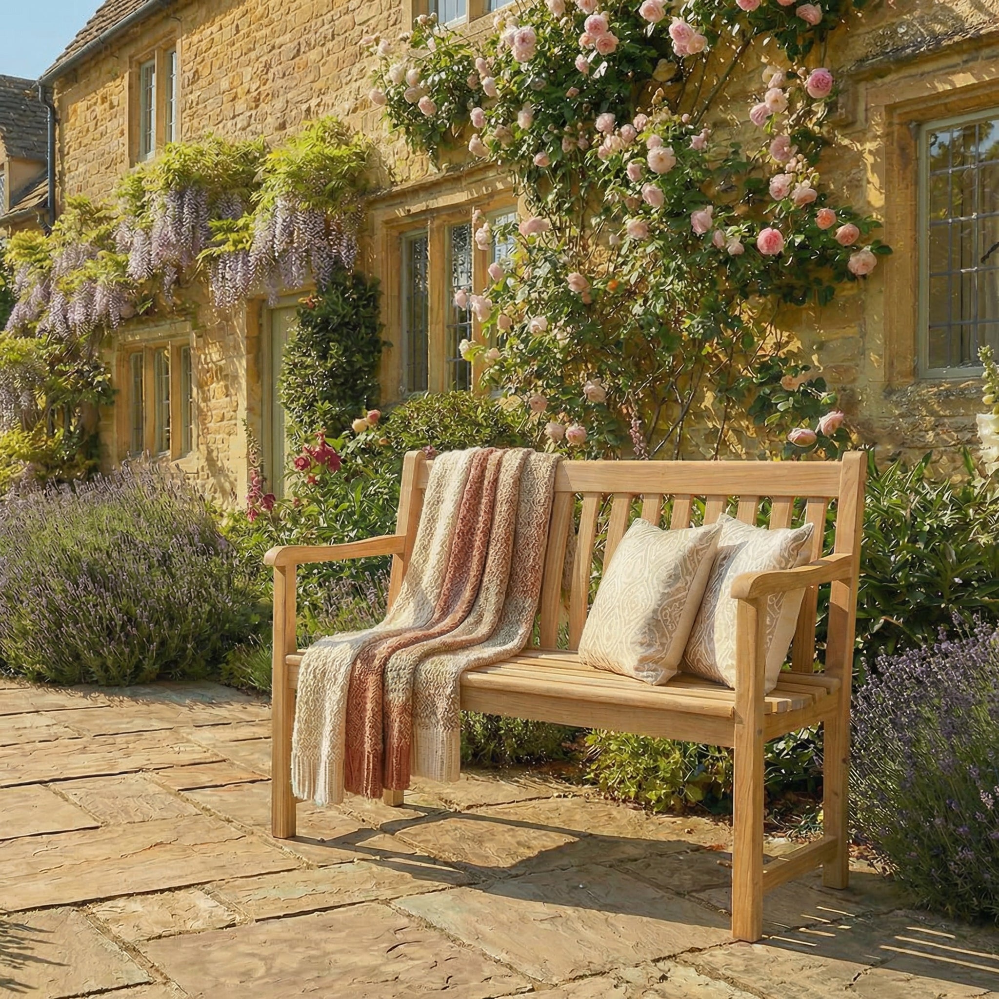 Roble wooden 4ft bench outside a Cotswold stone home.
