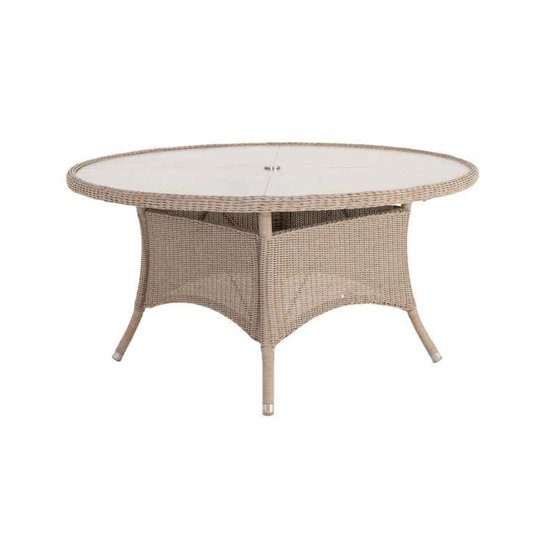Round wicker outdoor table with glass top on a white background