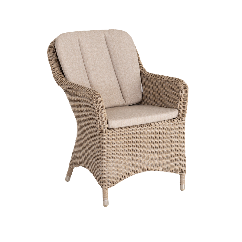 Wicker chair with beige cushions on a white background