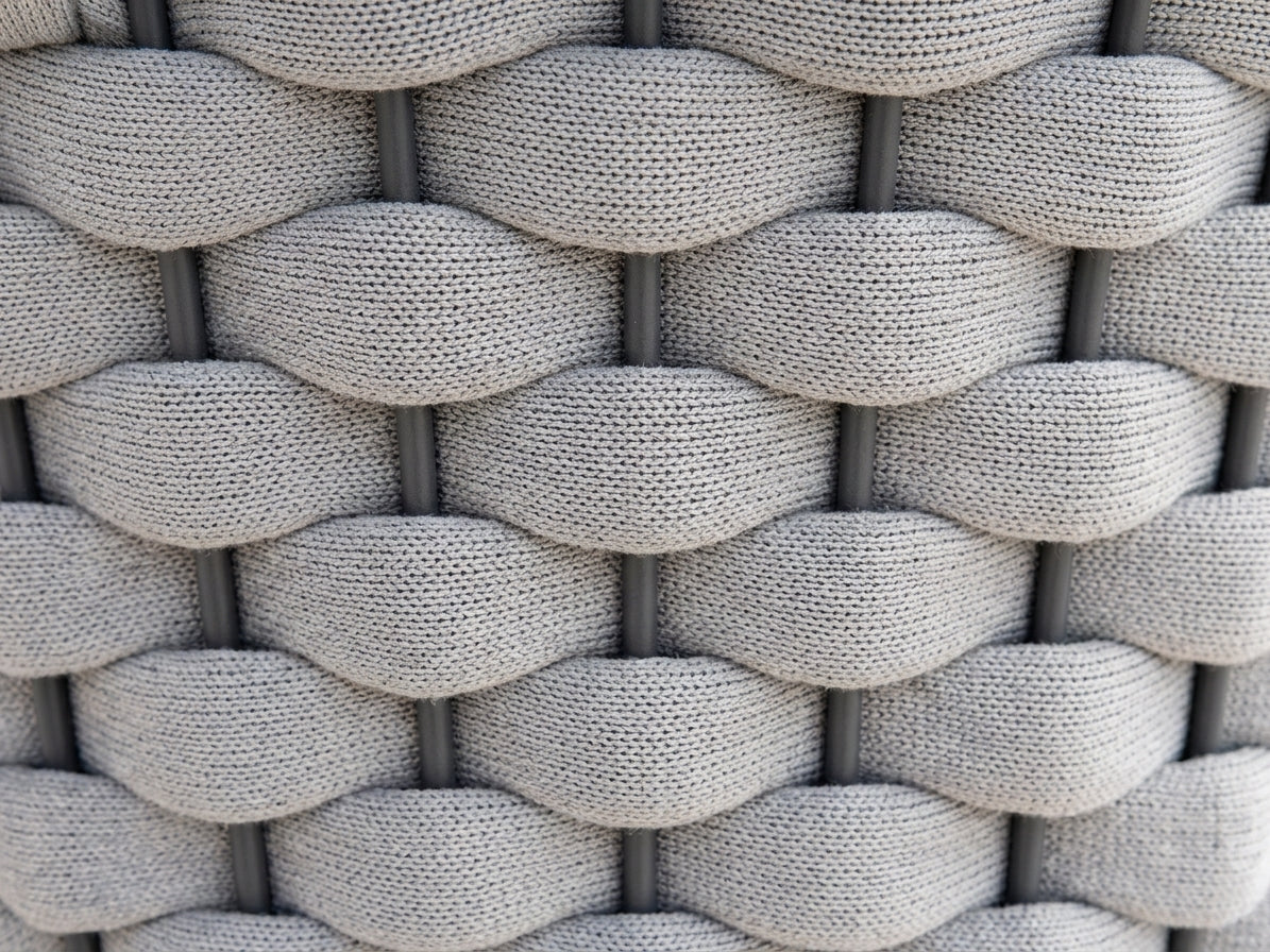 Close-up of a textured woven pattern in grey tones