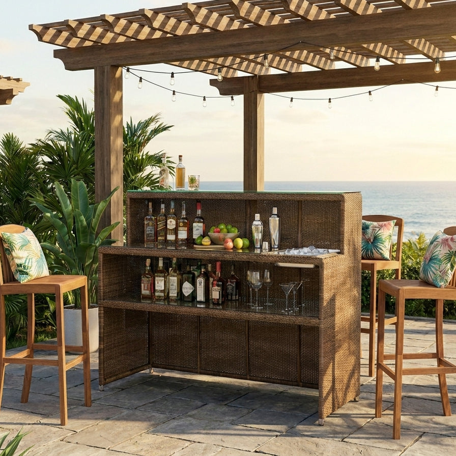 Outdoor bar setup with drinks and barware under a wooden pergola with ocean view.