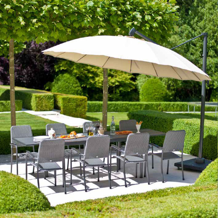 large cream parasol over large rectangular garden table and chairs