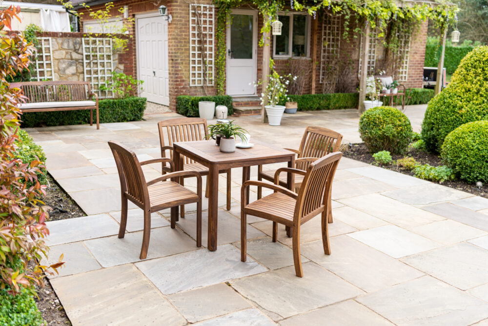 Alexander Rose Bolney square table and 4 chairs on a cottage patio