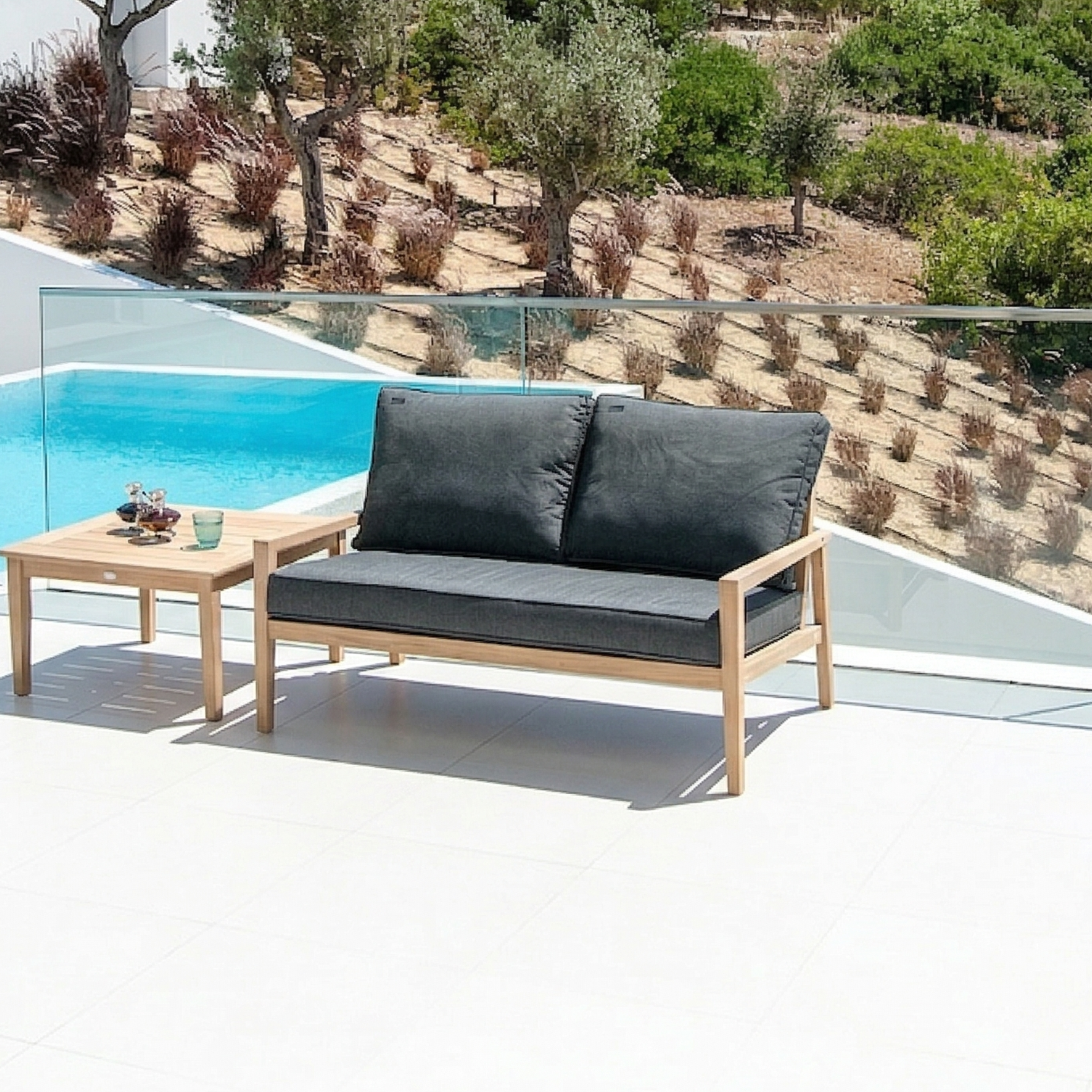 2-seater lounge sofa and coffee table. Sofa has two plump back cushions and a deep seat cushion