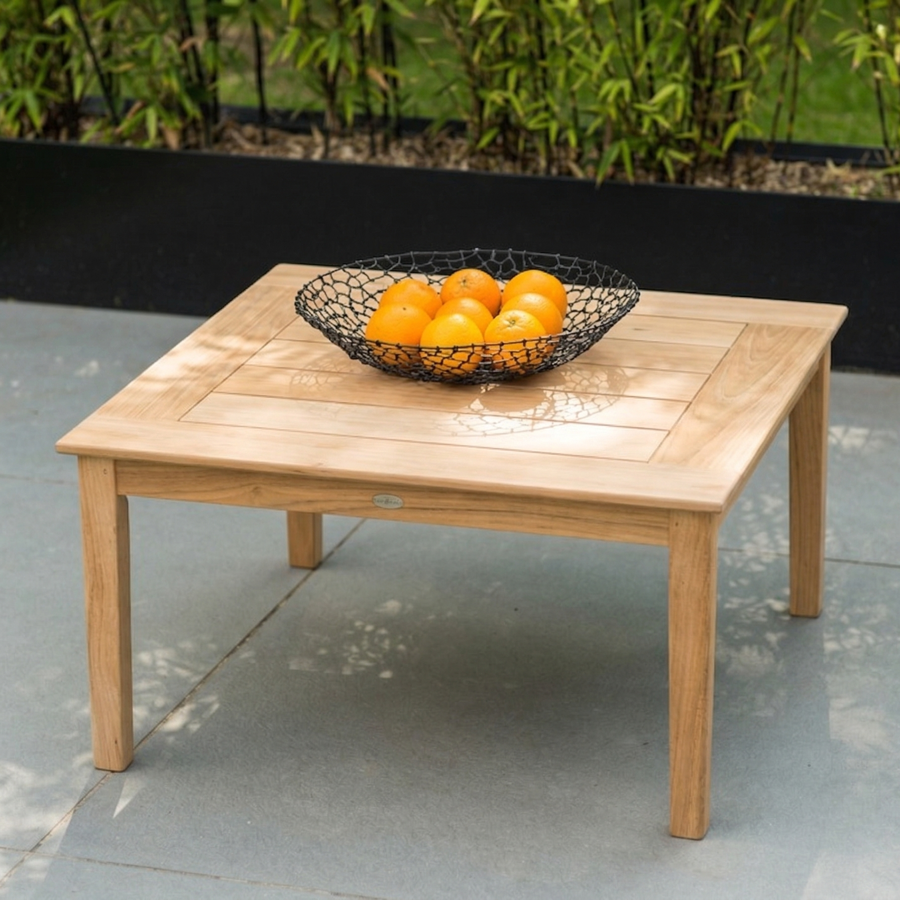 Small roble coffee table with a basket or oranges