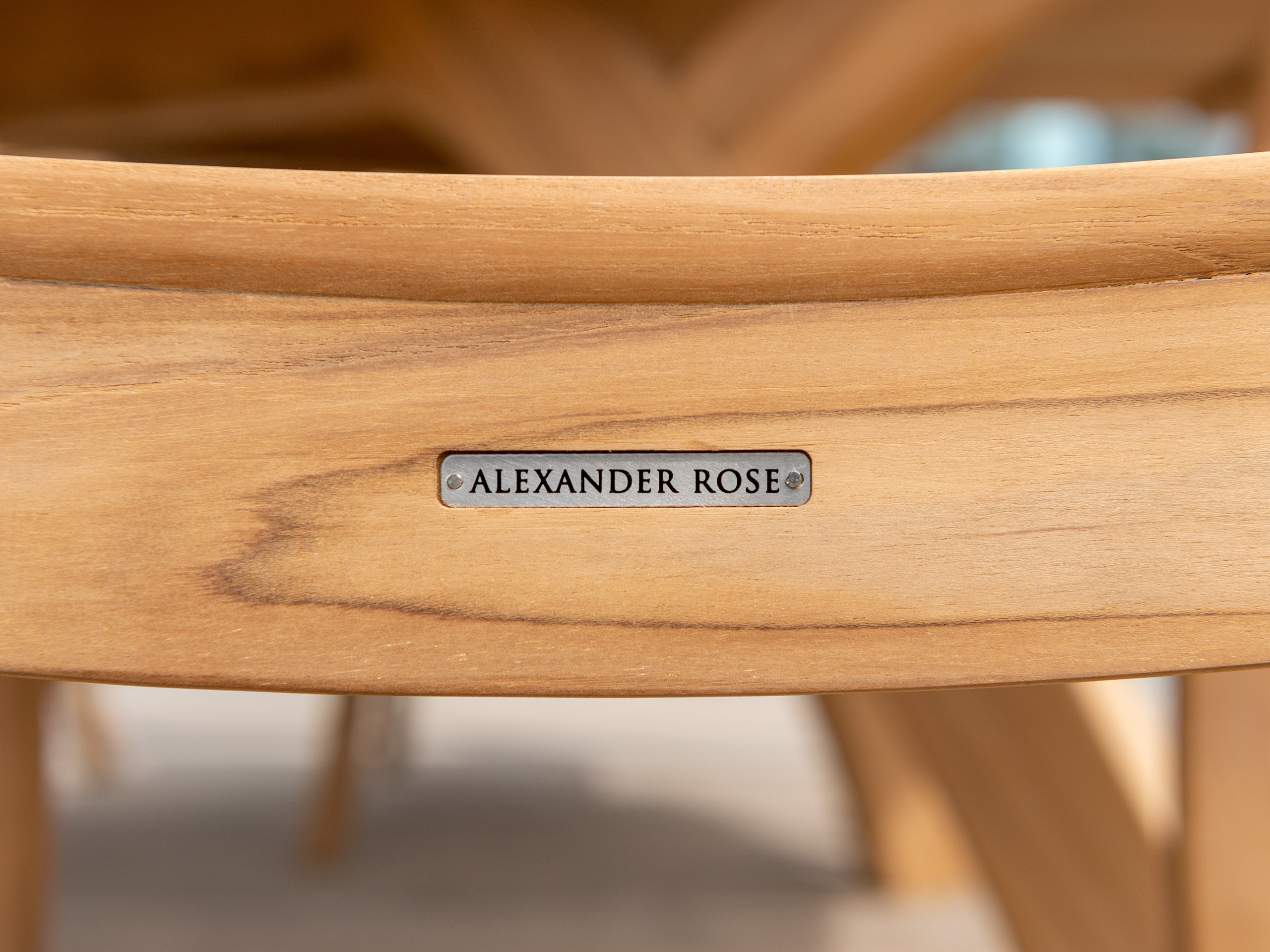 Alexander Rose metal label recessed on the back of a wood dining chair