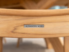 Alexander Rose metal label recessed on the back of a wood dining chair