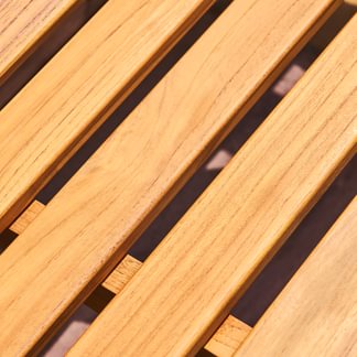 Close-up of wooden slats with a dark background