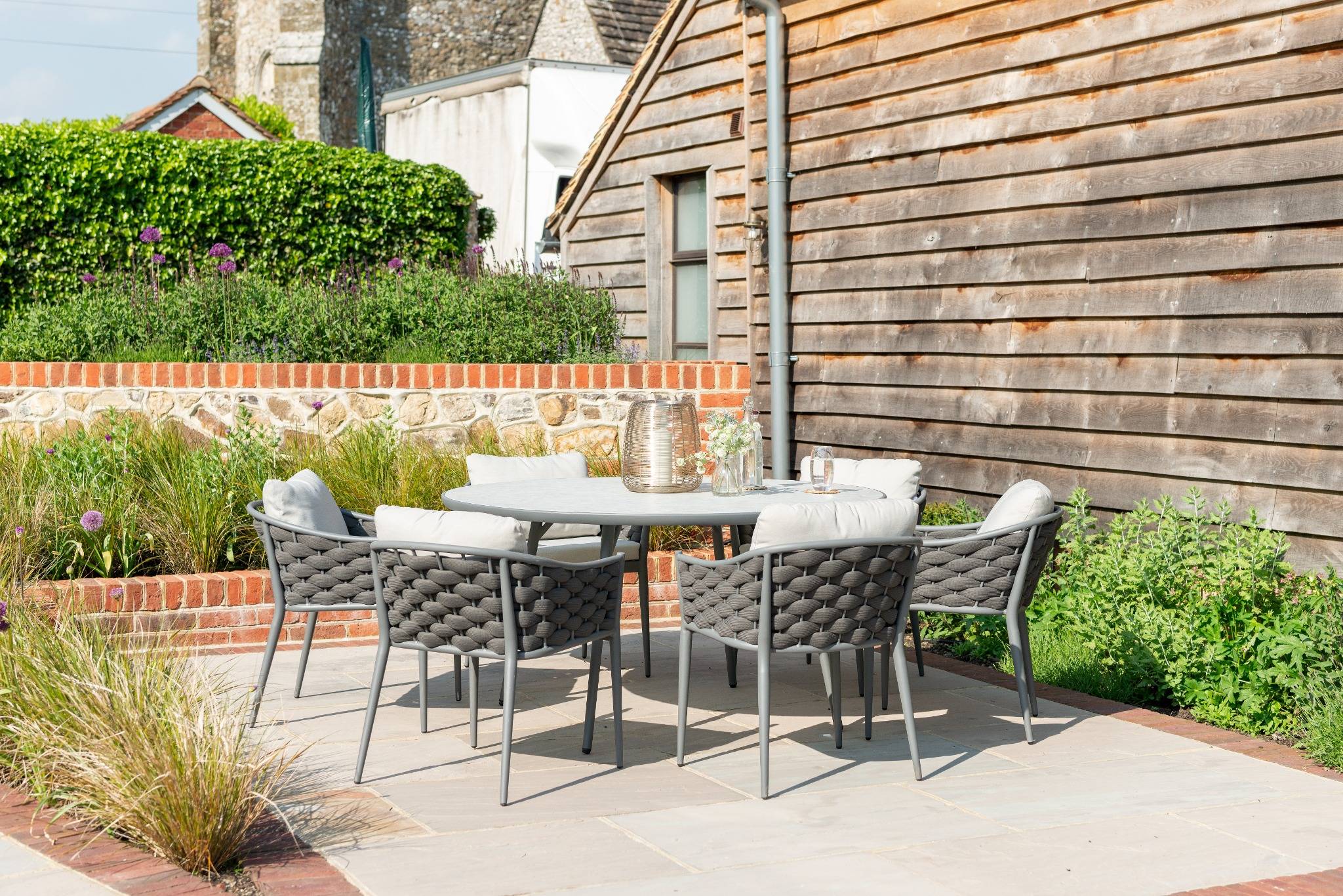 Torino Large Round  Dining Table Presented with a Set of 6 Dining Chair