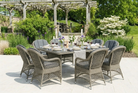 Monte Carlo Luxury Rattan 8 Seat Casual Dining Set in a garden setting