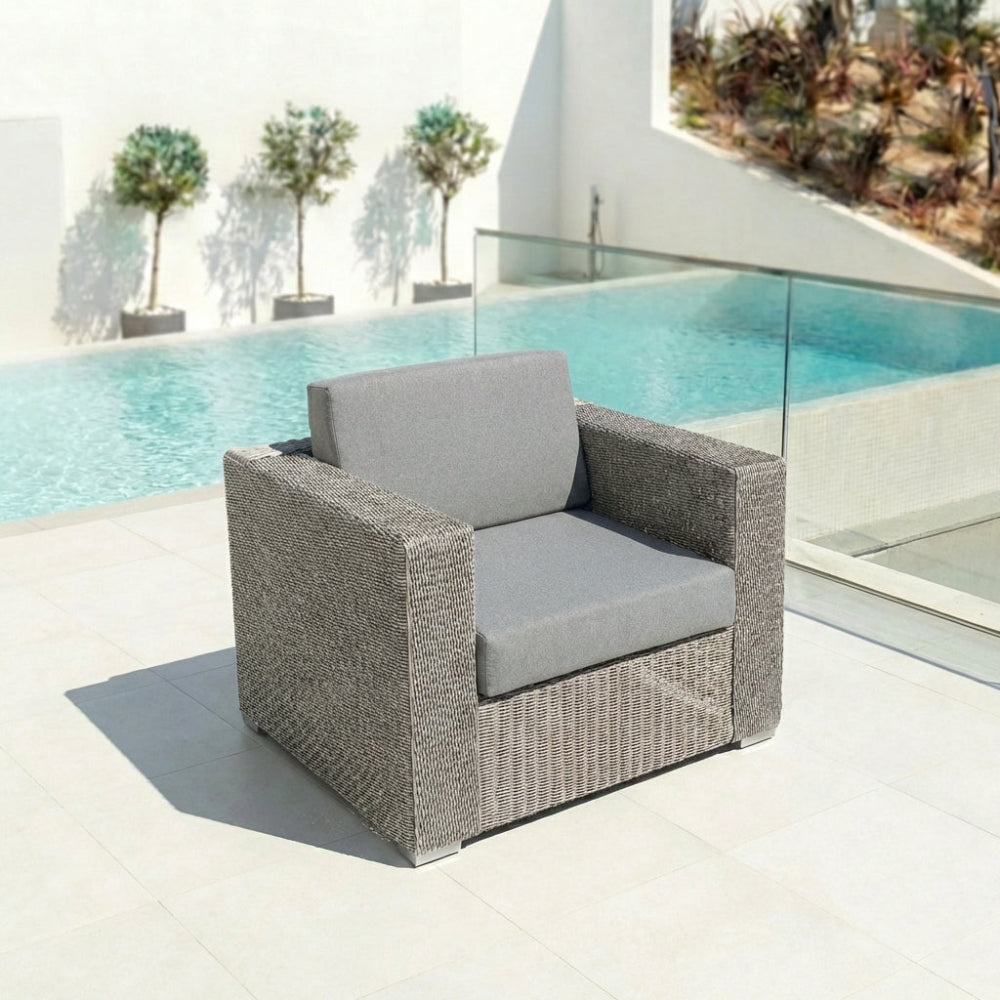 Monte Carlo lounge chair on a terrace beside a swimming pool under natural daylight.