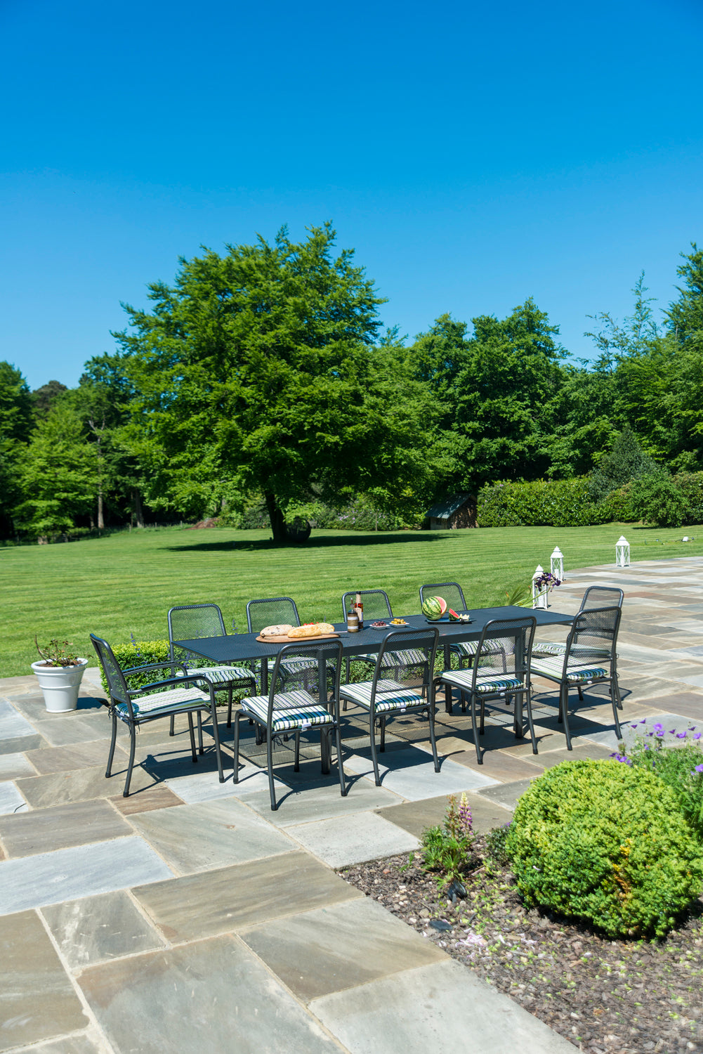 Portofino extending rectangular dining table with 8-side chairs and 2-armchairs