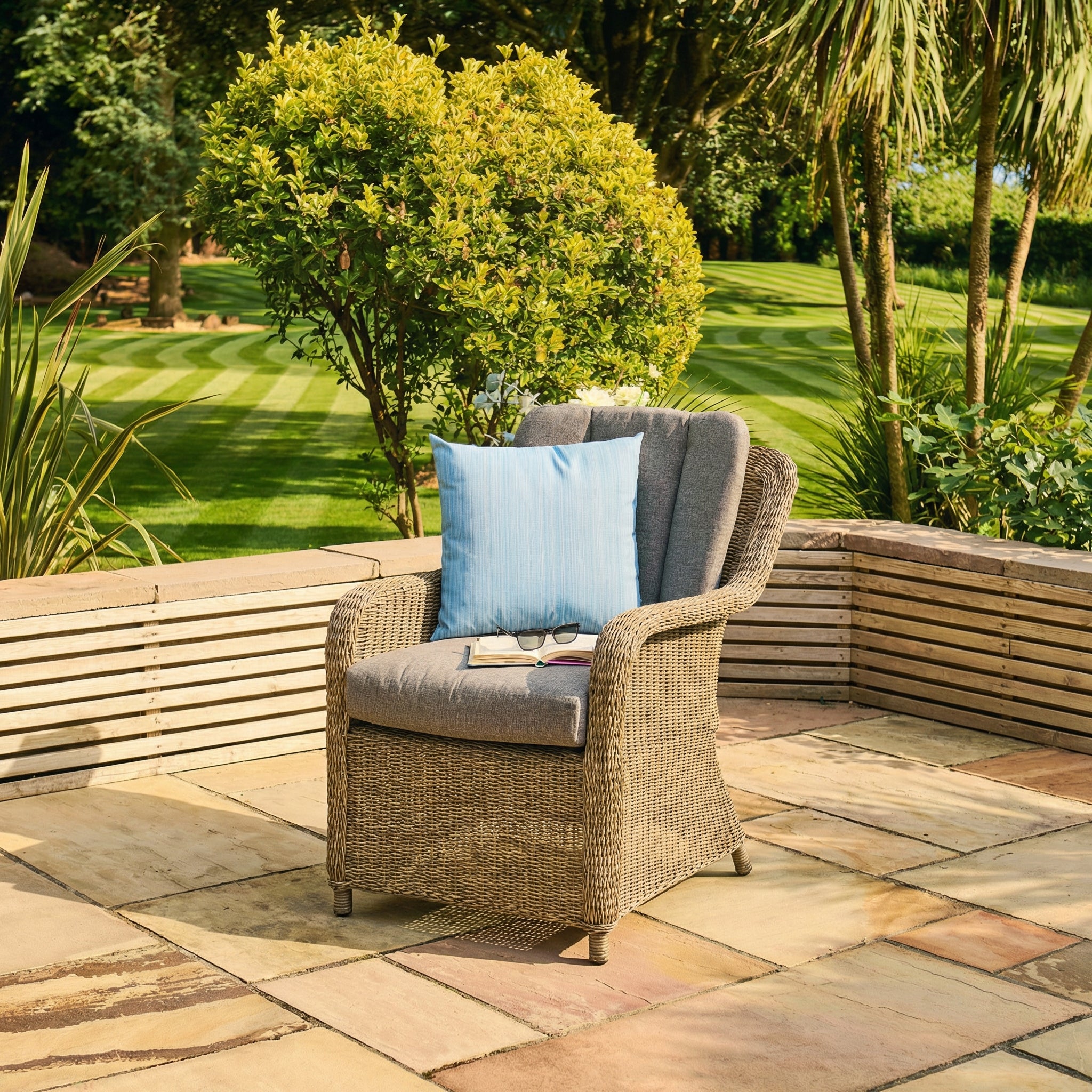 Luxury rattan dining armchair on a patio