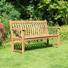 Albany Broadfield Bench Wooden bench in a garden setting with greenery