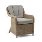 Wicker armchair with gray cushion on a white background