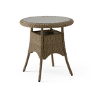 Round wicker table with a glass top on a white background
