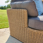 Wicker chair with cushions on a patio