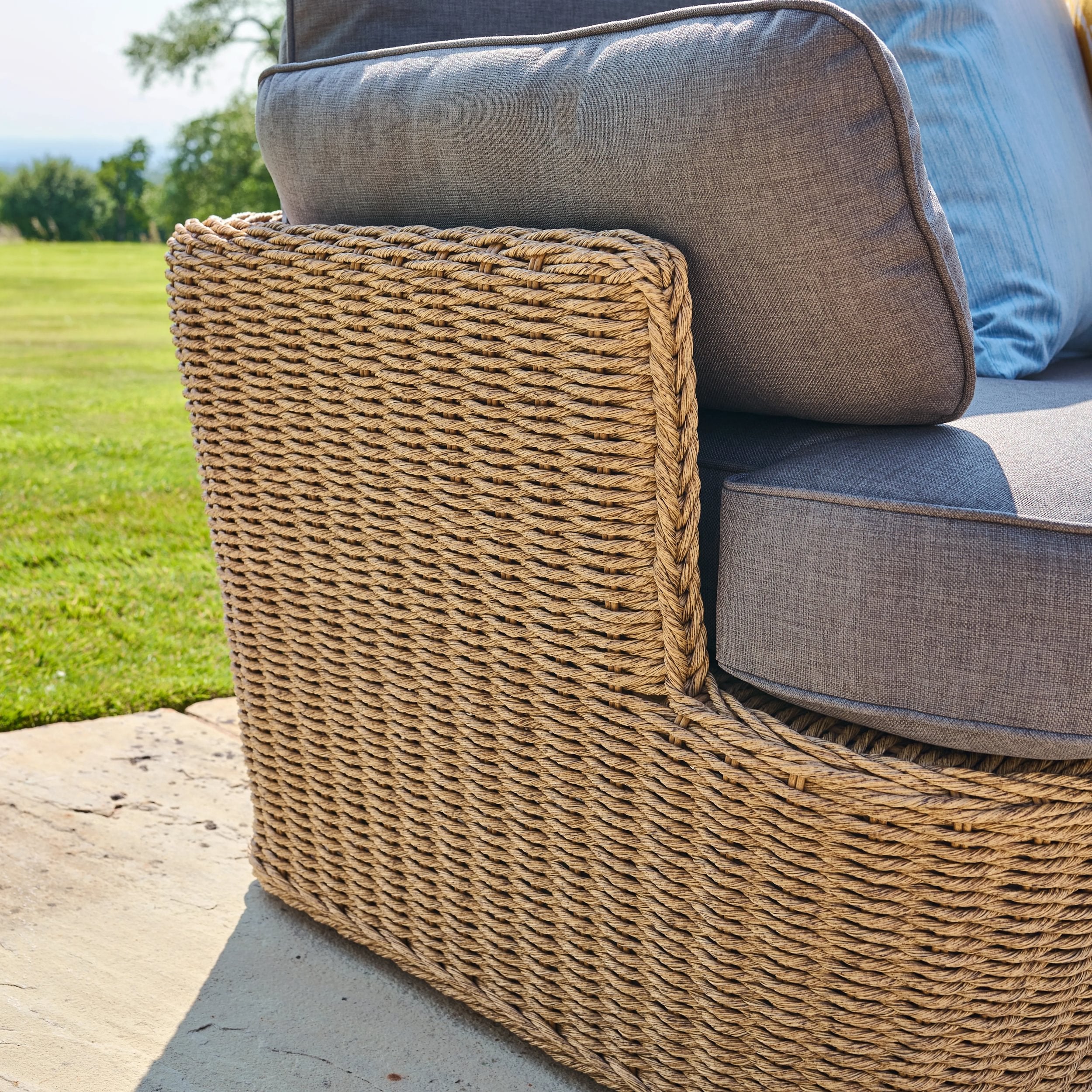 Wicker chair with cushions on a patio