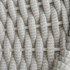 Close-up of the beige rope weave material used on the Cordial chair, showing its contrasting texture and detailing.