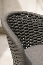 Close-up of a textured chair seat with woven pattern