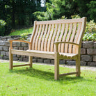 Wooden bench with a high curved back