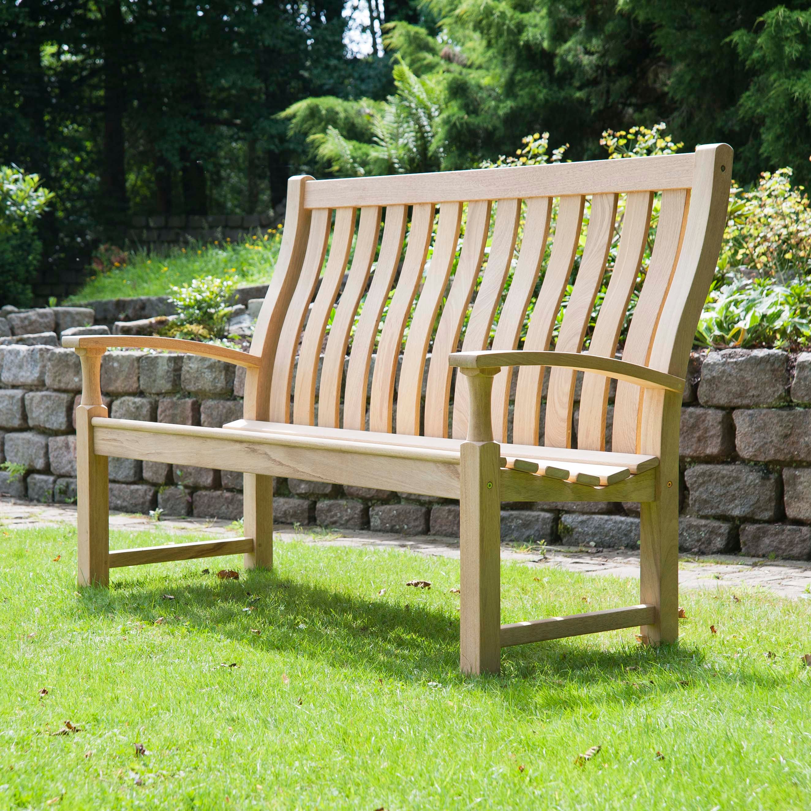 Wooden bench with a high curved back