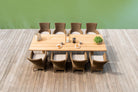 Teak rectangular dining table with luxury rattan armchair's top view
