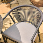 Grey rope weave chair on a patio